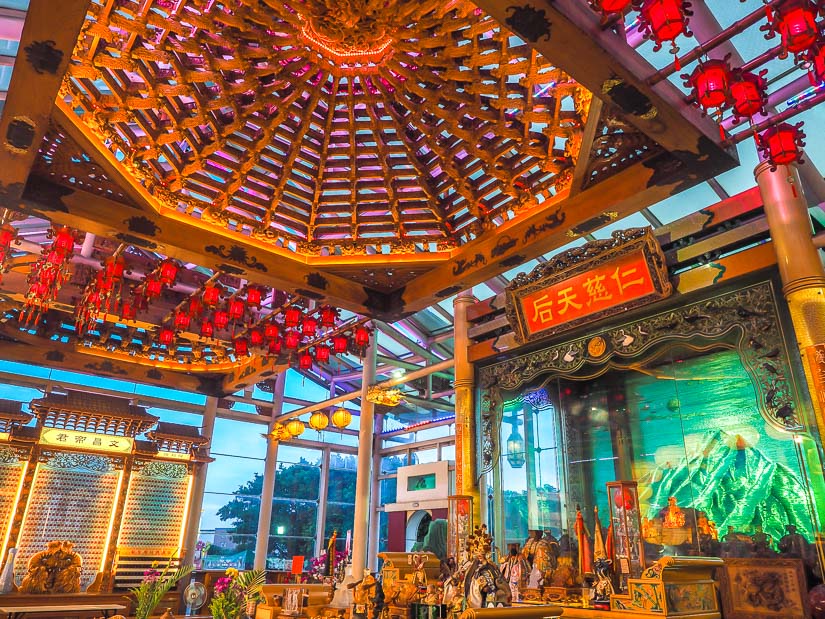 Interior of a glass temple in Lukang, with various colorful designs, decorations, and lit up elements