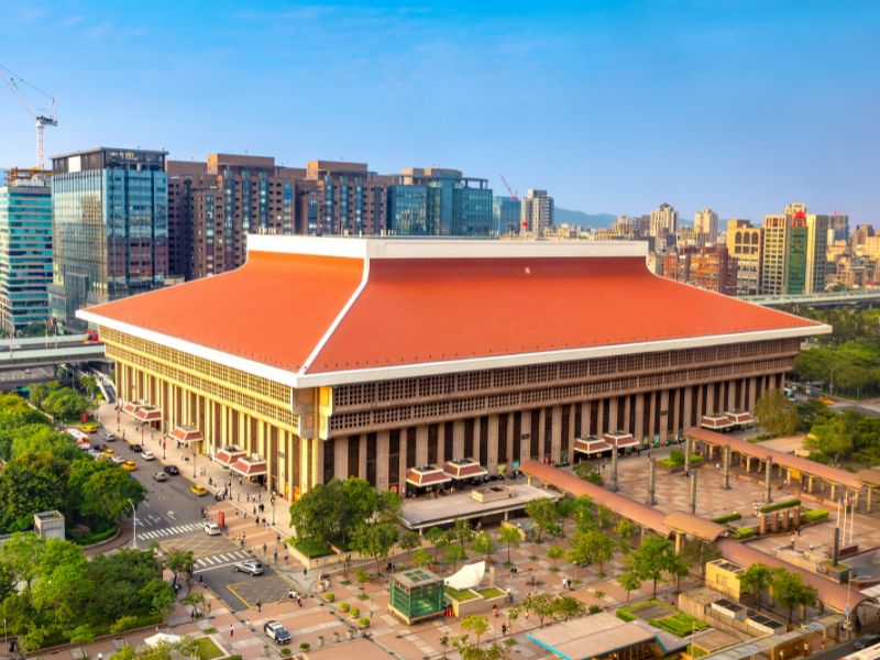 View from above of the large Taipei Main Station building with orange roof