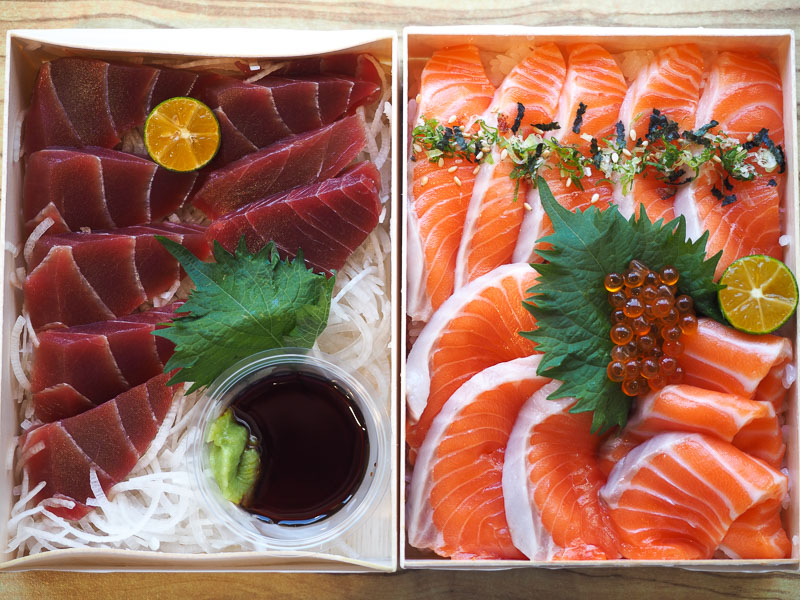 A platter with two kinds of sashimi: salmon and bluefin tuna