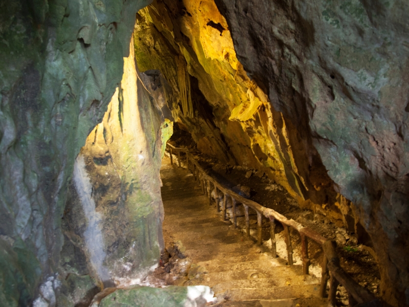 A path with rail through a cave