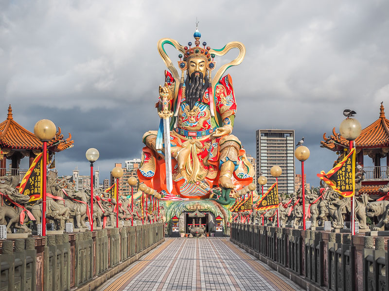 A giant god statue with walkway leading to it