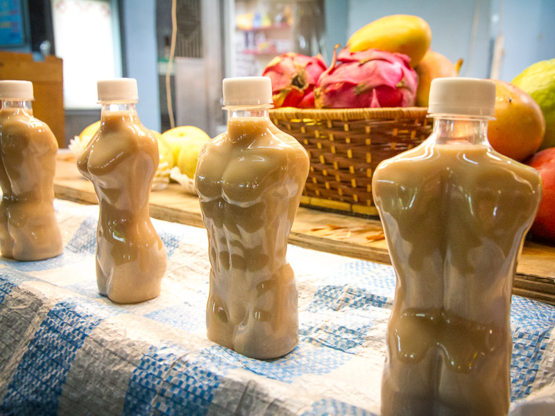 Bottles of milk tea on display in Raohe Night Market and each one is shaped like a man's or woman's body