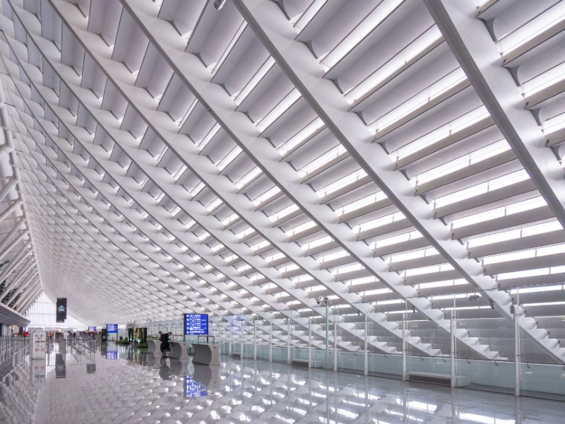 A long hall with slanting white ceiling in Taoyuan International Airport