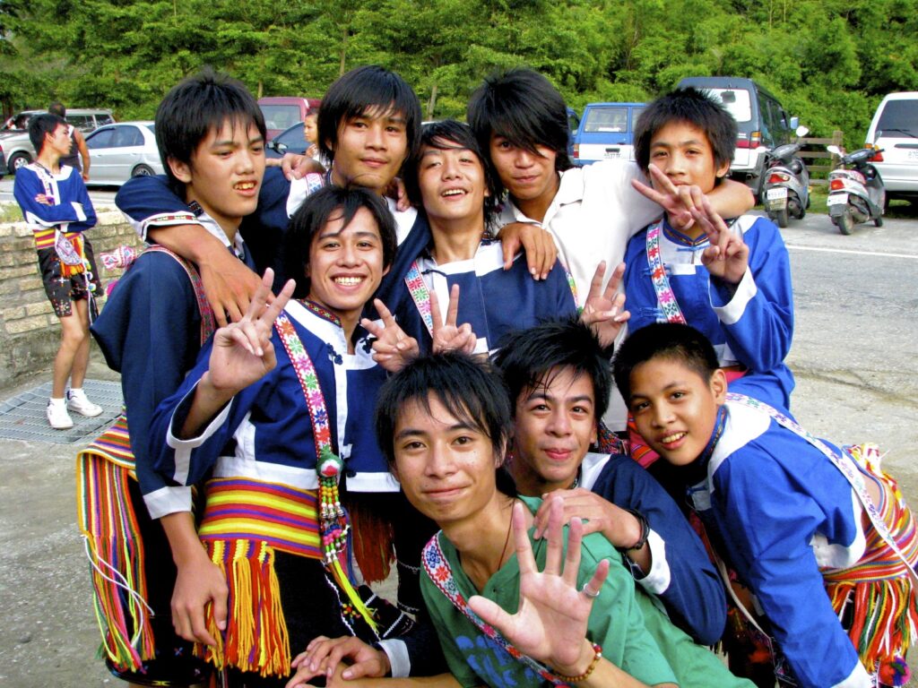 A group of young Taiwanese aboriginal men posing for the camera