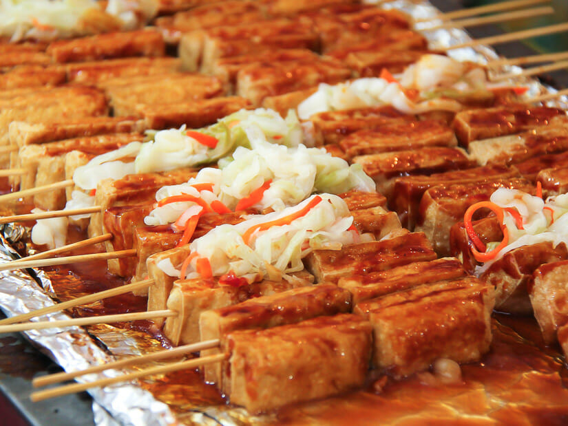 Sticks of grilled stinky tofu in Taiwan